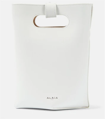 Маленькая кожаная сумка-тоут в сложенном виде Alaïa, белый 6950274