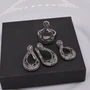 Комплект ювелирной бижутерии серьги, кулон и кольцо 19 р, покрытие: посеребрение, вставка: фианиты, цвет: графитовый, арт.213.381-19 213.381-19