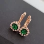 Серьги Каталог >> Бижутерия >> Ювелирная бижутерия Дубайское золото, с покрытием позолотой, вставка: фианиты и крупный зеленый камень, арт.214.627 214.627