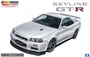 06558  автомобили и мотоциклы  NISSAN BNR34 SKYLINE GT-R V SPEC II White  (1:24) 4905083065587